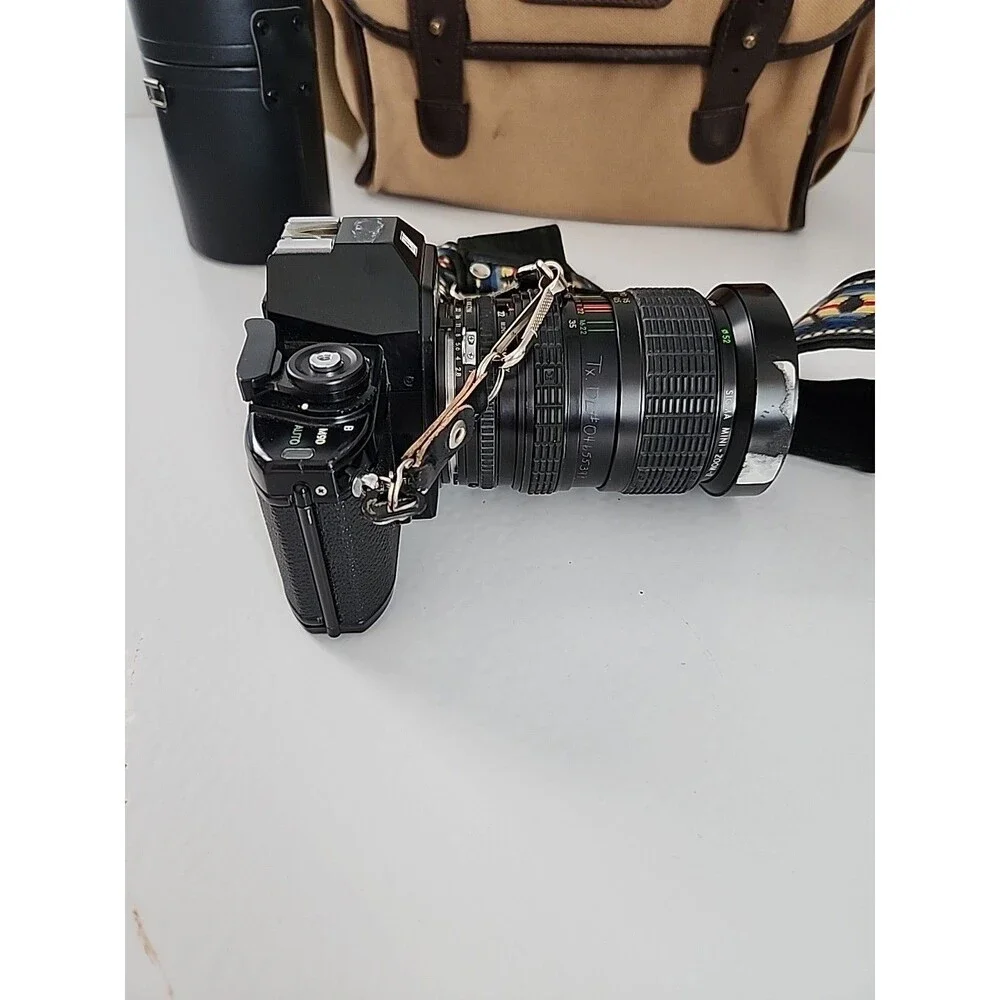 Nikon EM 35mm SLR Film Camera Black Body w/ Extra Lens, Bag & Accessorie